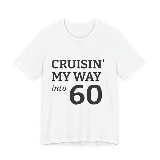 A white short-sleeve crewneck t-shirt with the text 'CRUISIN' MY WAY into 60' printed in black on the front, displayed against a solid white background.